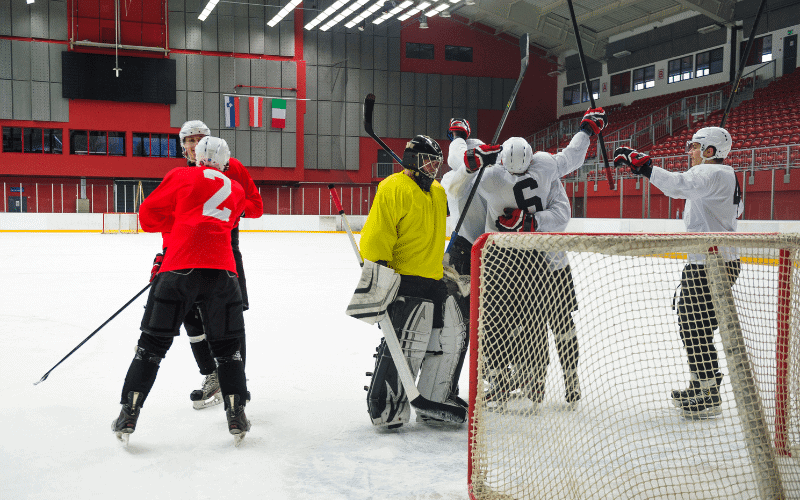 A group of hockey players in action, celebrating significant moments in the sport's history